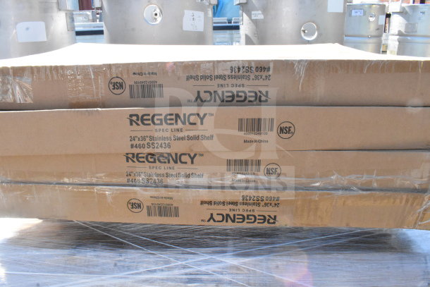 Stack of Regency Spec Line 24"x36" stainless steel shelves in original boxes, NSF certified, minor scratches.