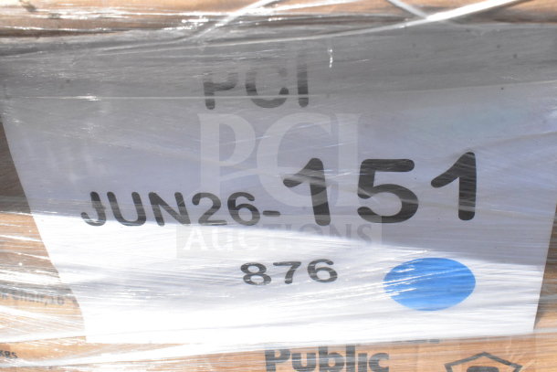 Plastic-wrapped items labeled "JUN26-151," including shelves, stool, and cart, marked as new scratch and dent.