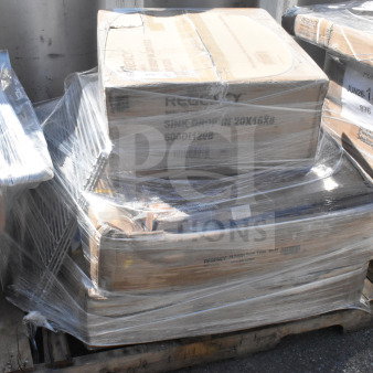 Shrink-wrapped pallet with scratch and dent items including shelves, a stool, and a cart. Regency box visible.