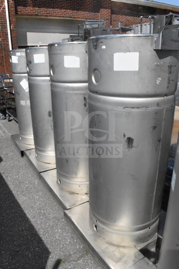 Four stainless steel Sharpsville container tanks, used condition, visible labels, located outdoors, buyer pickup required.