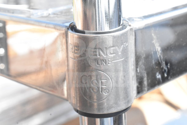 Stainless steel Regency NSF-certified cart joint, clear markings, sturdy construction, commercial casters indicated.