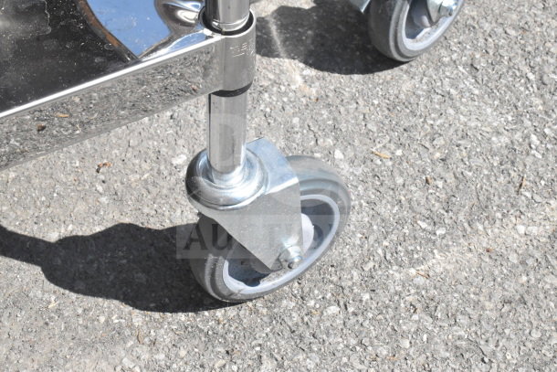 3 Tier Cart with durable metal shelves on sturdy commercial casters, showcasing smooth mobility and robust construction.