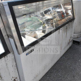 Master-Bilt commercial ice cream dipping cabinet with glass display and stainless finish. Visible wear and rust marks.