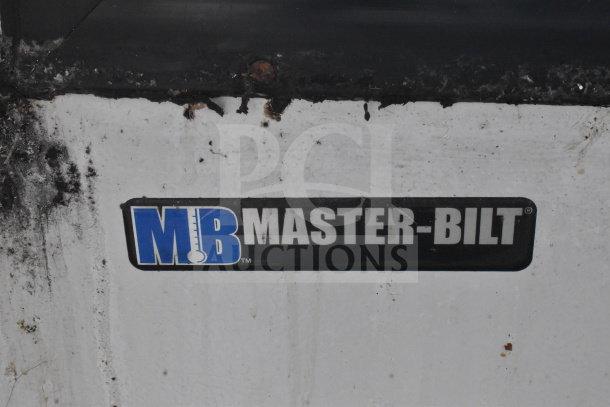 Master-Bilt Commercial Ice Cream Dipping Cabinet label. Brand: Master-Bilt. Condition shows visible wear and rust.