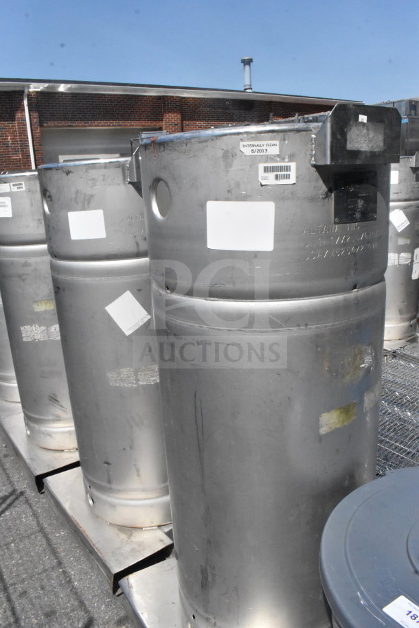 Four Sharpsville Container Tanks, stainless steel, outdoor setting. Labels indicate internal cleaning date 5/2013. Buyer pick-up only.
