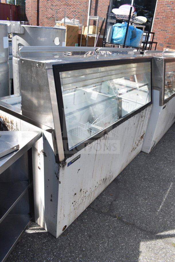 Master-Bilt commercial ice cream dipping cabinet with glass display, visible wear and stains, large capacity interior.