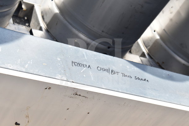 Metal equipment with markings "1828197A CHHILL BJT Times Square" indicating potential model and location. Auction of two units.
