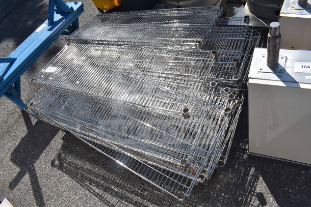 Lot of 18 chrome finish wire shelves, stacked. Each shelf has circular corner mounts, showing minimal wear.
