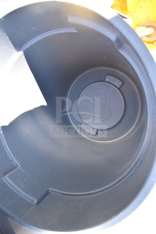 Gray trash can with slightly used interior, accompanied by a yellow mop bucket. Auction item includes both items.