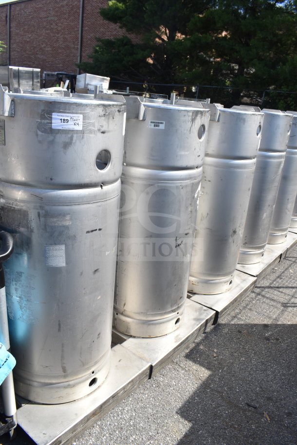 4 Sharpsville stainless steel tanks in used condition on a pallet. Each shows labels indicating sale in a batch of four.