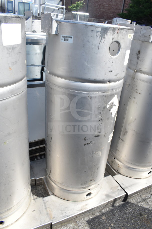 4 stainless steel Sharpsville Container Tanks in used condition with visible wear and barcode labels. Buyer pick-up required.