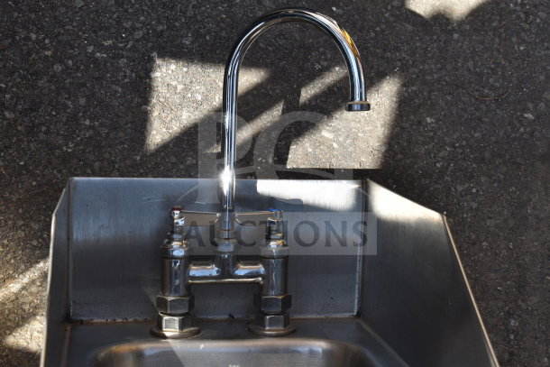 Single Bay Wall Mount Sink with attached chrome faucet, stainless steel, good condition, suitable for commercial use.