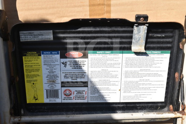 A-frame ladder step stool warning label with safety instructions, caution notes, and contact information.
