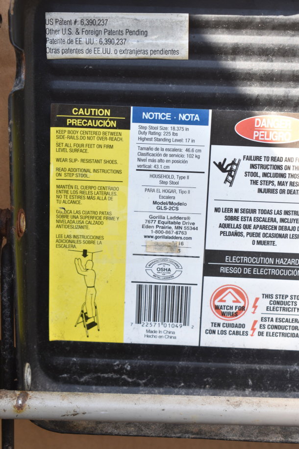 Gorilla Ladders A Frame Ladder with label details, model GLS-2CS, duty rating 225 lbs. Shows safety and usage instructions.