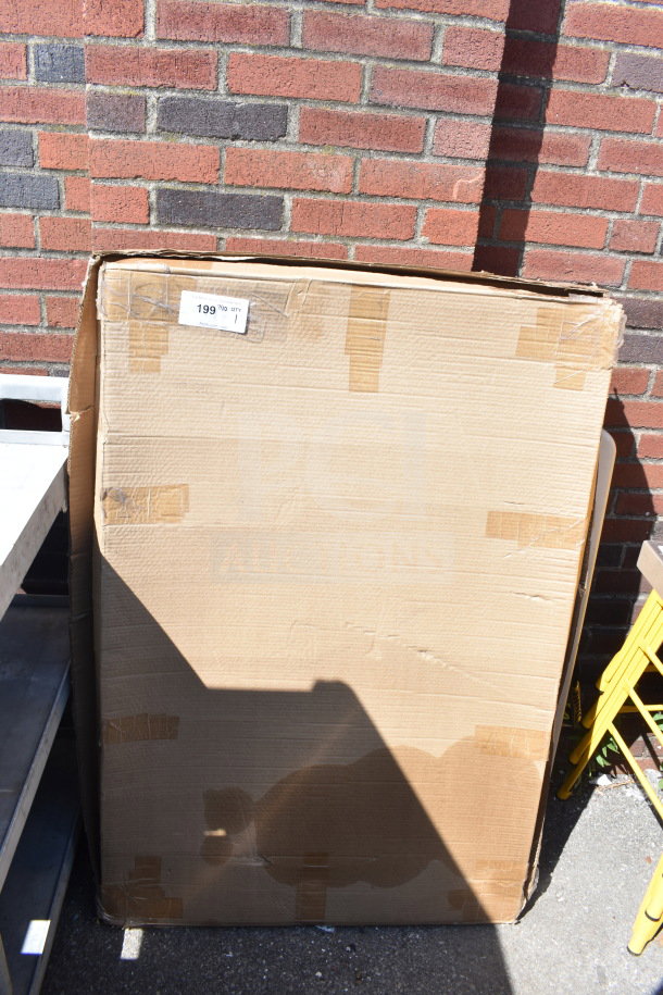 Cardboard box containing tabletop with cow painting, tape-sealed, has a price label reading "199".