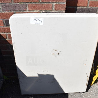 White bi-fold folding table, showing light stains and minor wear. Auction tag "200 7/10 QTY 1" visible.