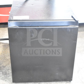 Hisense 32KHS310986 mini cooler, black, 115 volts, 1 phase. Minor exterior wear, model tag visible on top.