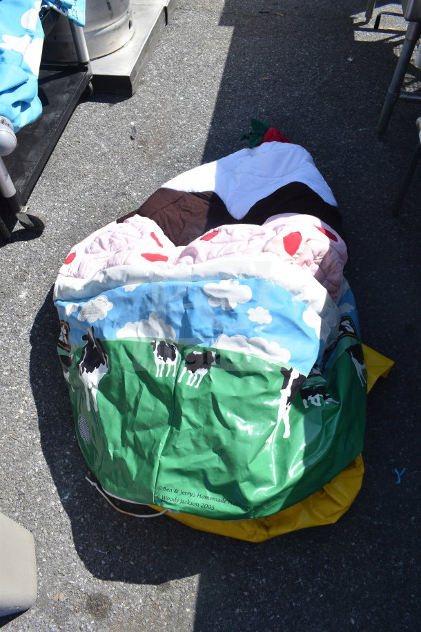 Lot of items including a Ben & Jerry's branded inflatable with cow print, Slim Jim trash can included, fair condition.