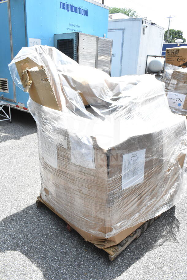 Pallet of 21 brand new scratch and dent items, including towels, fry cutter, and table, wrapped in plastic. Labels visible.