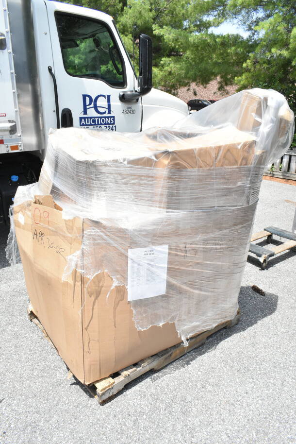 Pallet of 21 new scratch and dent items wrapped in plastic, including towels, fry cutter, and table. Label indicates "APR 30-02."