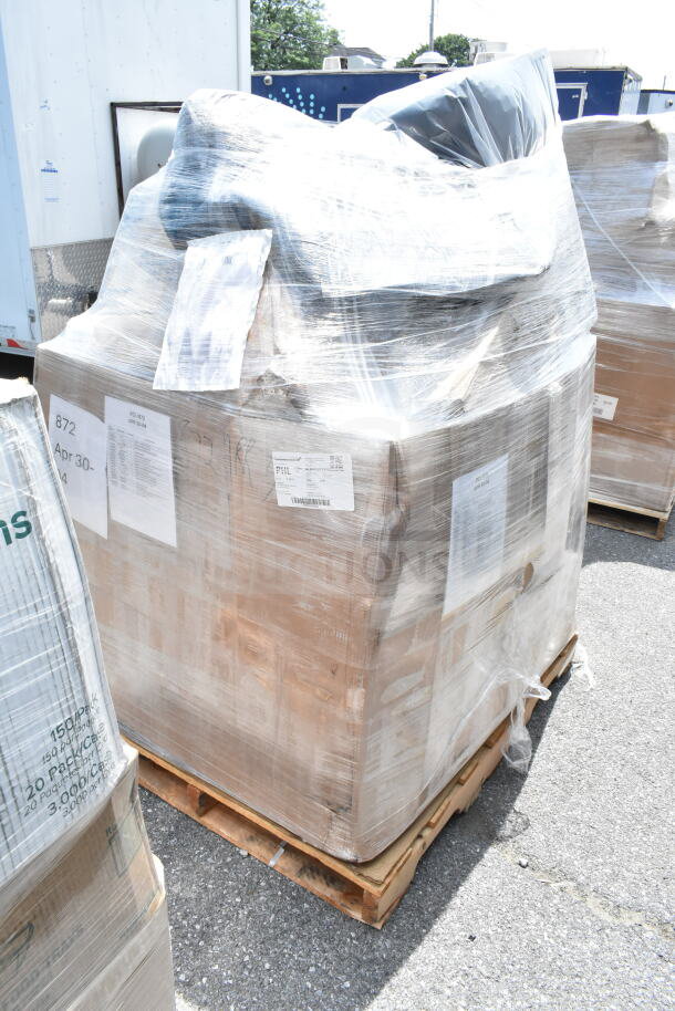 Pallet of 18 brand new scratch and dent items, including towel dispensers and cups, wrapped in clear plastic. Labels visible.