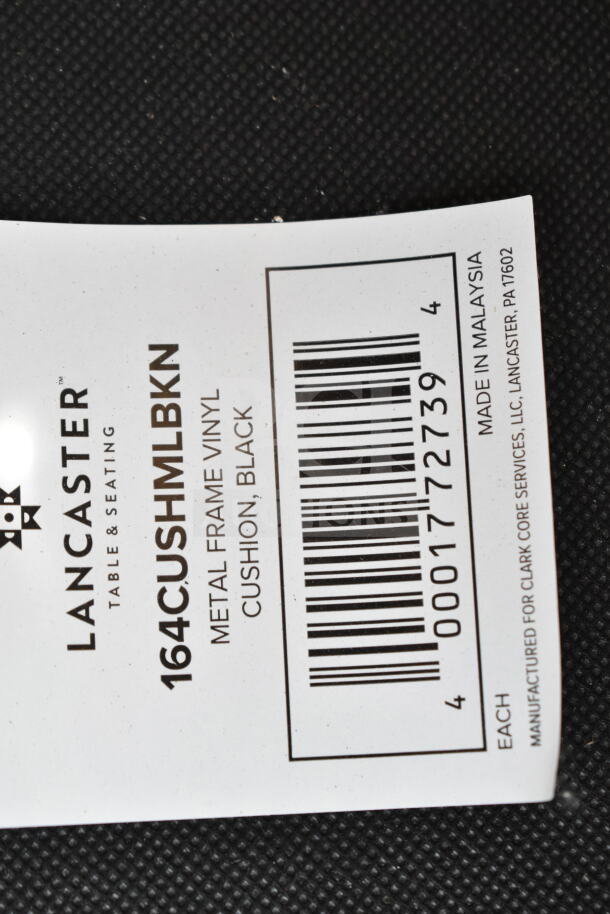 Lancaster chair label, model 164CUSHMLBKN, metal frame, black vinyl cushion, made in Malaysia.