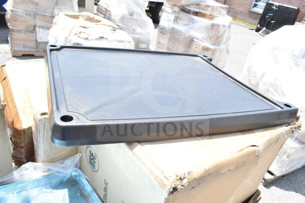 New utility cart top on a cardboard box, part of a scratch and dent auction lot. Box shows signs of wear.