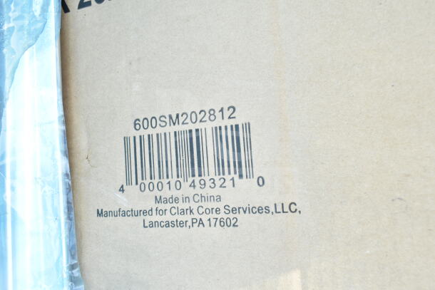Cardboard label showing barcode 600SM202812, "Made in China," and manufacturer details for Clark Core Services, LLC.
