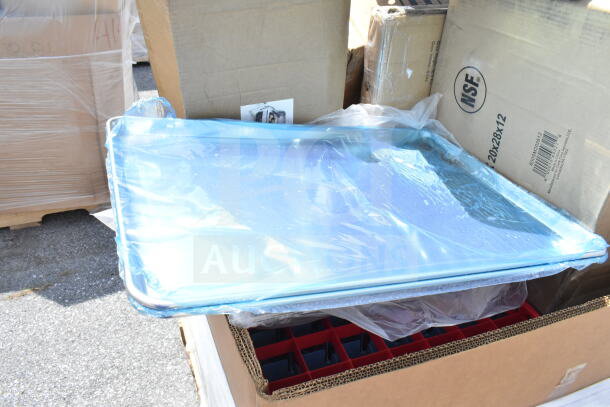 Box of brand new scratch and dent items including a mop sink, utility cart. NSF marking visible. Packaged and ready for bid.