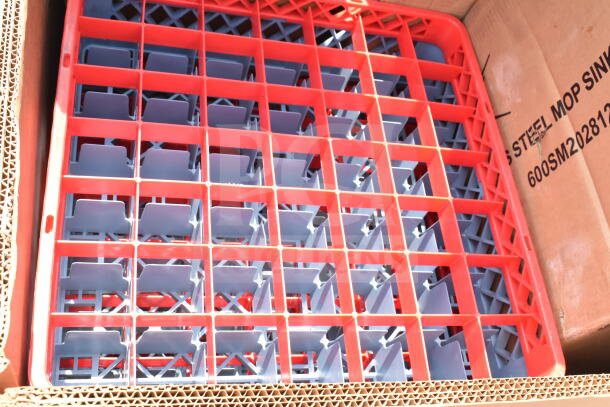 Red and blue plastic rack inside cardboard box labeled "Steel Mop Sink 600SM202812." Appears new, auction item.