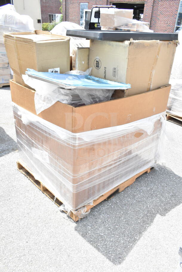 Cardboard box on pallet with shrink wrap, containing 12 scratch and dent items including mop sink, utility cart. New condition.