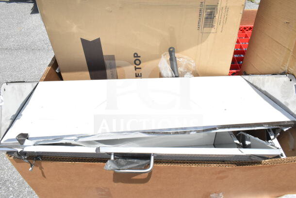 12 new scratch and dent items including mop sink, utility cart in packaging. Visible damage, sold as-is.