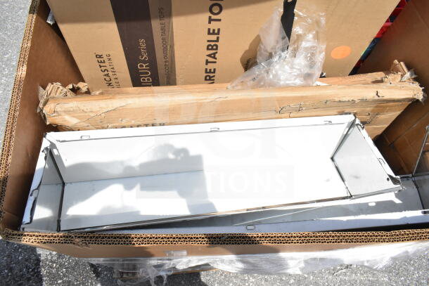 12 brand new scratch and dent items, including a mop sink and utility cart, shown in open packaging revealing minor wear.