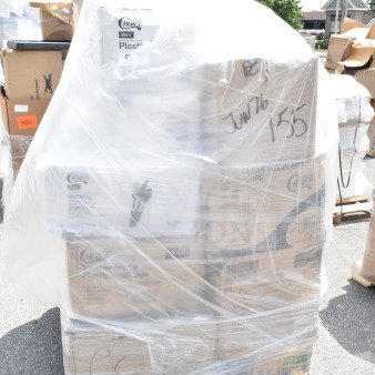Plastic-wrapped pallet with boxed items, including napkins, cold cups, and bowls labeled "Choice." Marked "Jun26-155."
