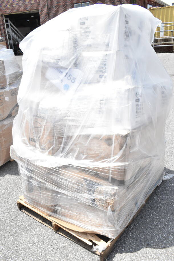 Pallet with 18 assorted "scratch and dent" items, including napkins, cold cups, and bowls, wrapped in plastic for auction.