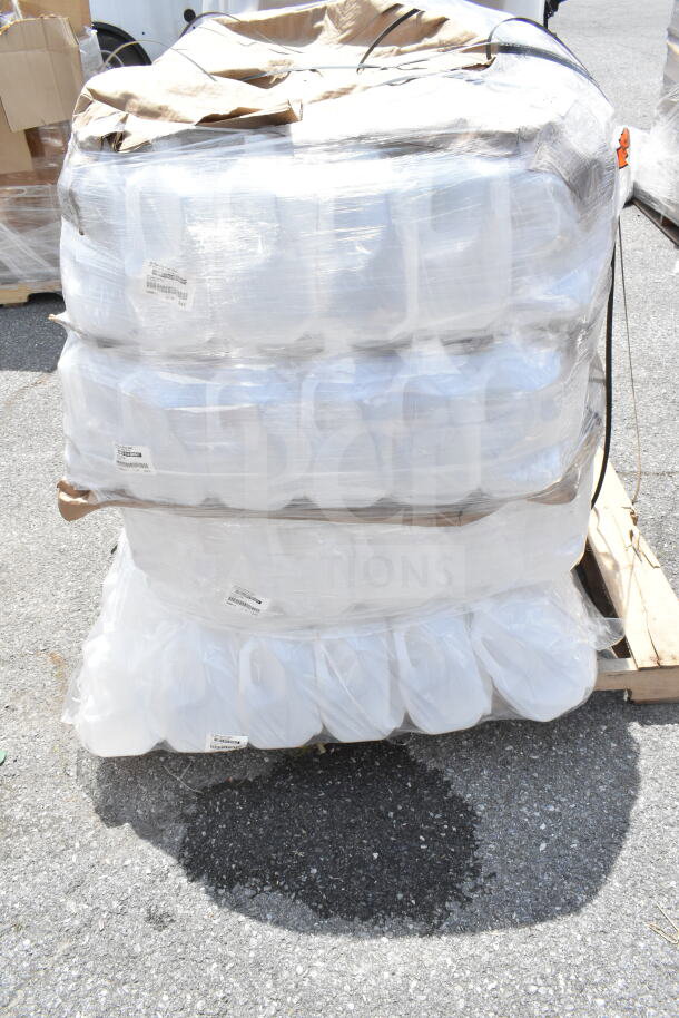 Bulk pallet of new plastic gallon containers wrapped in plastic. Labeled as scratch and dent, stacked in four tiers.