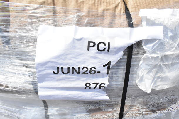 Pallet with wrapped gallons labeled "PCI JUN26-1 876," showcasing scratch and dent condition. Auction lot of 4 times your bid.