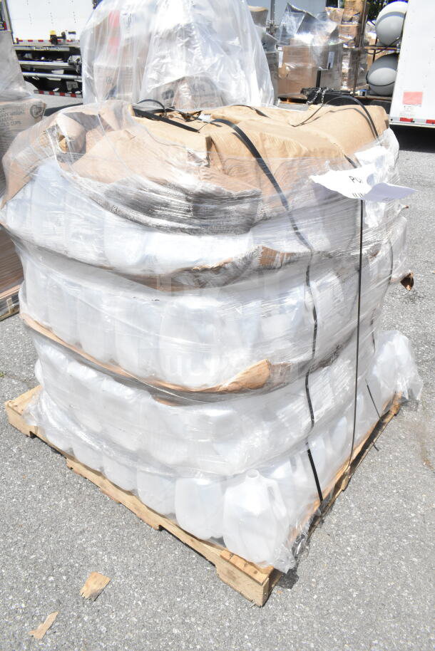 Pallet of scratch and dent plastic gallon containers, new condition, shrink-wrapped and ready for auction.