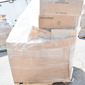 Shrink-wrapped pallet of 14 brand new scratch and dent items, including boxes labeled "Graphic Packaging" and "Fragile: Handle with Care."