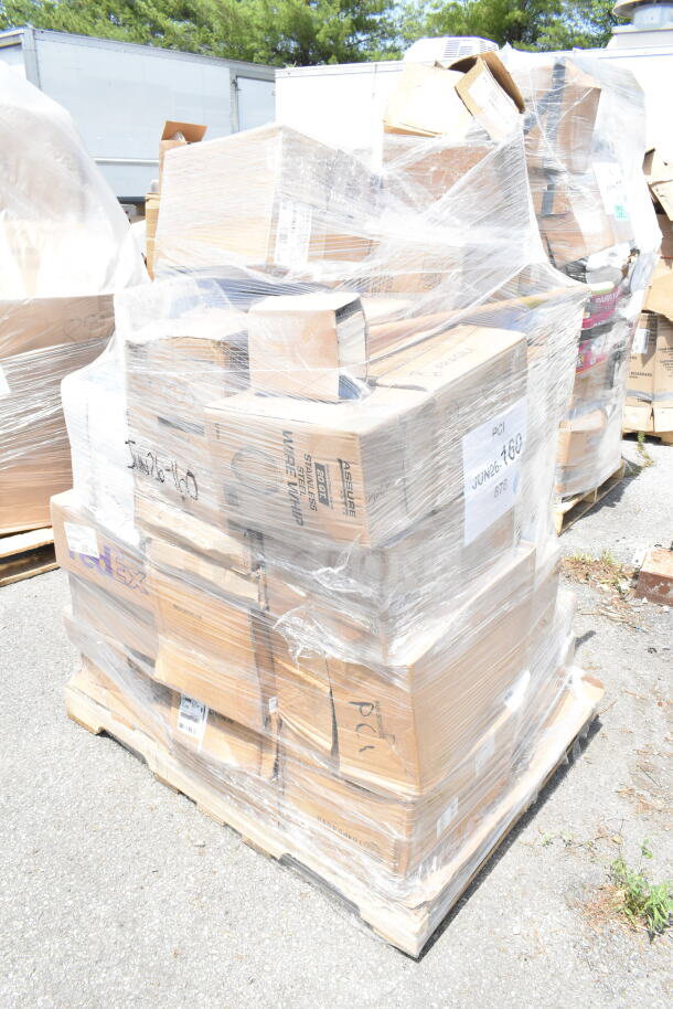 Pallet of assorted boxed items labeled "JUN26-160," wrapped in plastic. Boxes contain glasses, containers, and saucers.