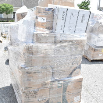 Pallet of 27 new scratch and dent items, including plastic cold cups and glasses, wrapped in plastic, visible box labels.