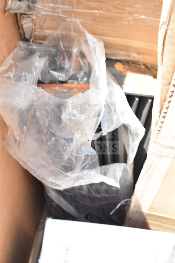 Box with plastic-wrapped, scratch and dent items, including a chafer and bussing cart. New condition, sold in bulk.