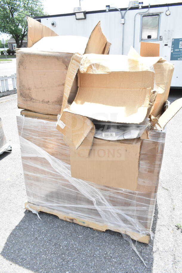 A pallet with multiple sealed cardboard boxes containing brand new scratch and dent items, including a chafer and bussing cart.