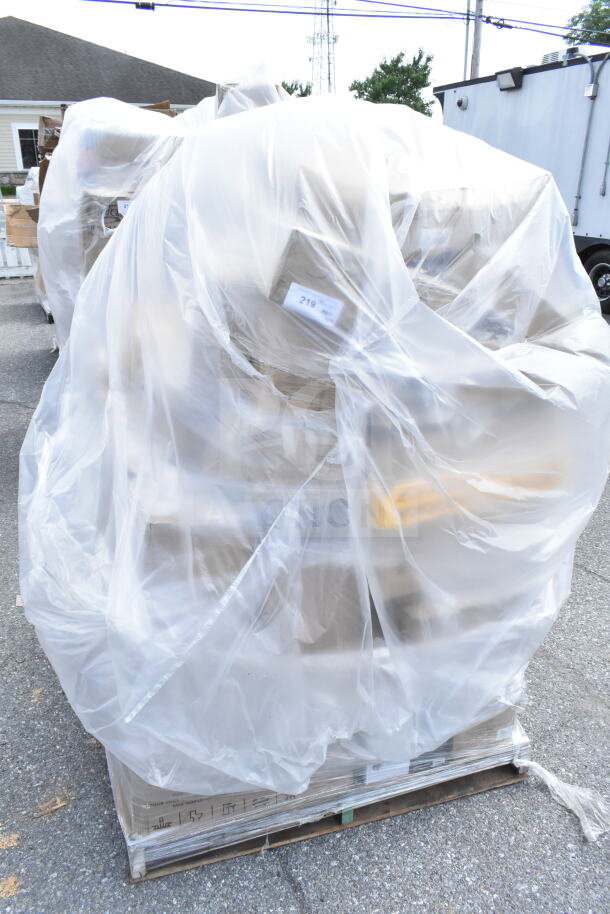 Pallet with 35 brand new scratch-and-dent items, including plates and hotel pans, wrapped in protective plastic.