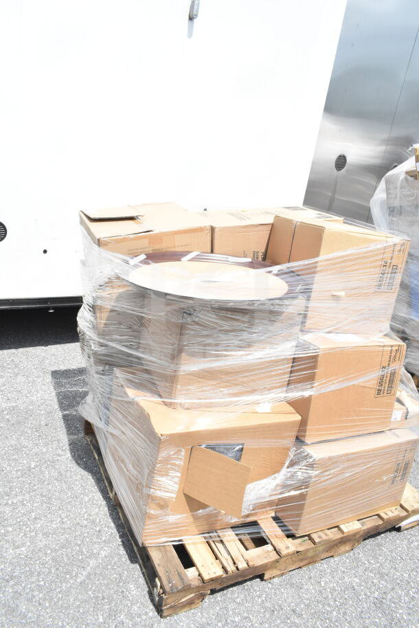 Pallet of 22 brand new scratch and dent items, wrapped, including paddle and serving tray. Ideal auction lot.