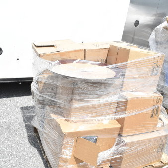 Pallet of 22 brand new scratch and dent items, wrapped, including paddle and serving tray. Ideal auction lot.