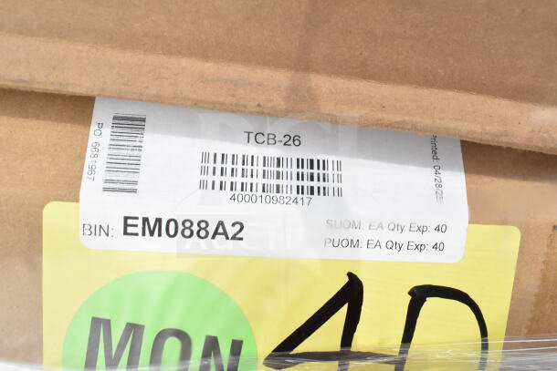 Cardboard box with labels showing barcodes, bin number EM088A2, and quantity details for auction item.