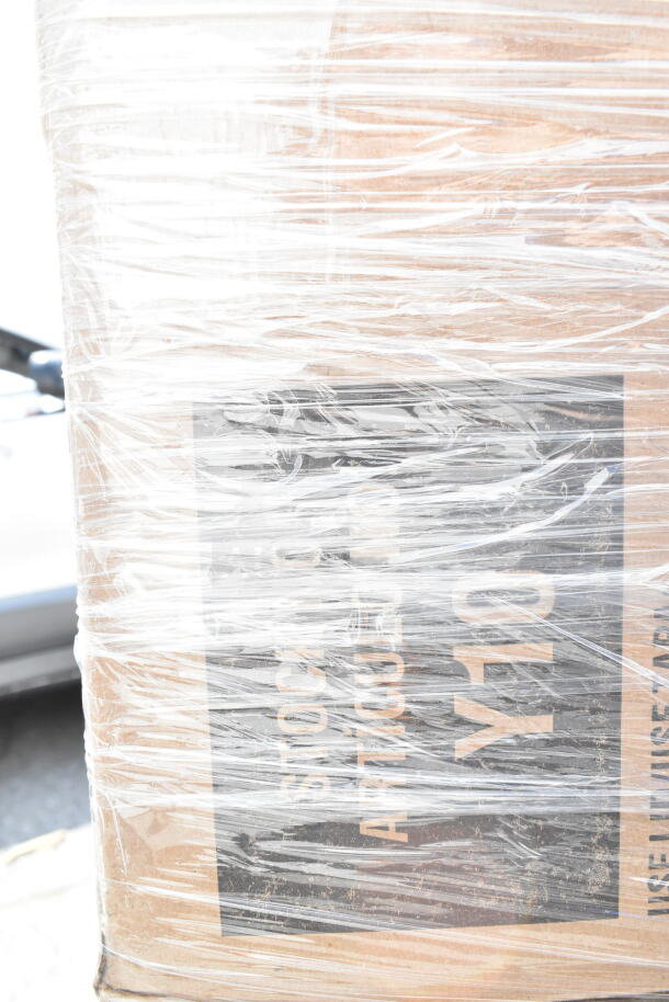 Shrink-wrapped pallet containing 22 brand new scratch and dent items including paddle and serving tray. Box labeled "Y10."