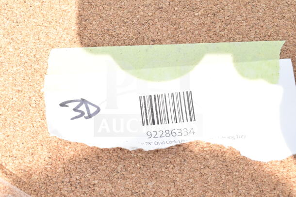 Barcode sticker on cork surface labeled "3D", item code 92286334, mentioning "28" Oval Cork-Lin..."