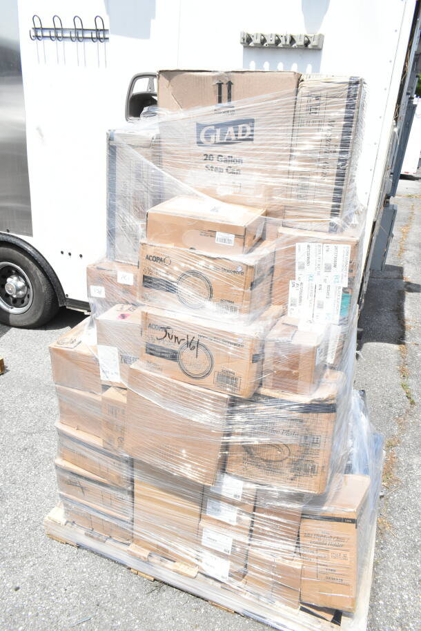 Pallet of boxes wrapped in plastic, marked "Glad" and "Acopa," including various household items. New scratch and dent condition.